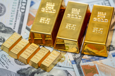 group gold bars and paper dollar bills as financial background. Exchange or saving conceptの写真素材