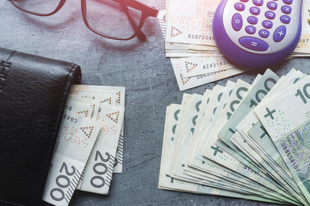 100 200 Polish zloty PLN banknote in black wallet. Financial saving conceptの写真素材