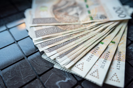 Close-up of 100 Polish Zloty PLN Banknotes on dark Background, financial concept investmentの写真素材