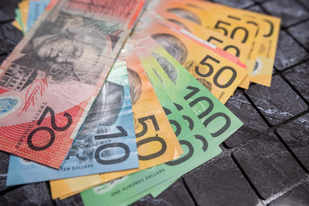 Various currency AUD Australian dollar notes as finance background on dark backgroundの写真素材
