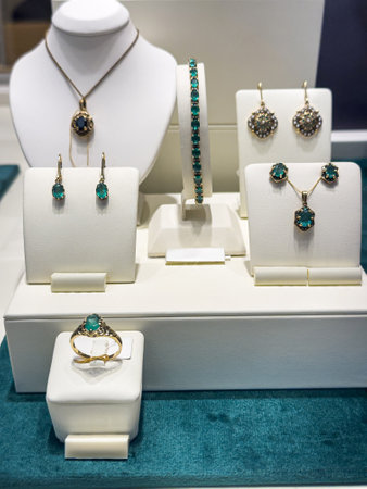 variety of golden rings, bracelets necklaces jewelry with diamant in store window. Shopping luxury conceptの写真素材