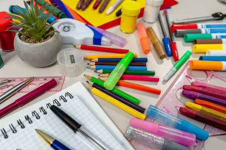 different school supplies on white desk background. Back to school concept. Flat lay composition Educationの写真素材