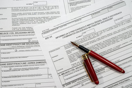polish tax forms pit 11 with pen on office table. Accounting concept. Annual information on advance income tax paymentsの写真素材