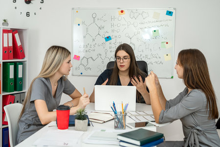 scientists work together in office with blackboard with drawn molecular structures, group chemistry studentの写真素材