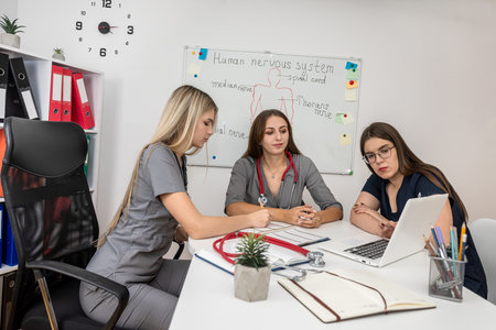 medical team of female nurse talking and meeting using a laptop in medical office. Health care conceptの写真素材