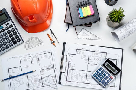 house plan blueprint pencil calculator tools helmet hardhat on office desk. Engineering or architecture conceptの写真素材