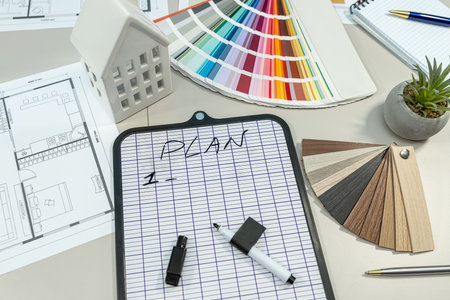 house model placed on meeting table with house model, interior design by using color palette pen pencil notepadの写真素材