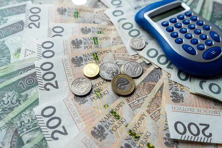 Pln polish money zloty with coin grosz and calculator. Calculation and accountingの写真素材