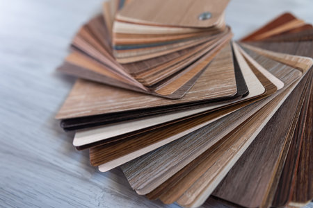 Samples of laminate or parquet variety of shades of wood floor. Engineered hardwood