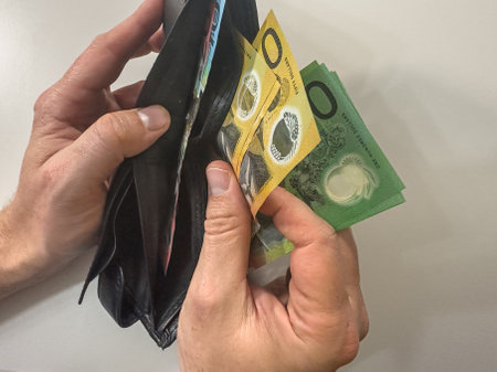male hand holding Australian Dollar in the wallet . Australian Dollar is the Currency of Australia. Financial conceptの写真素材