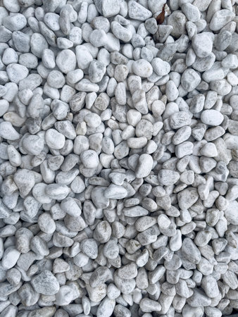 Small grey pebbles background. Design for home decoration. Rock stone
