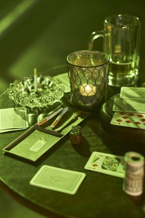 Gambling, tobacco and drinks on tableの写真素材