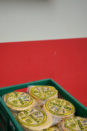 tortilla packaging in front of colorful wall. High quality photo