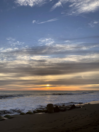 beautiful meulaboh beach with sunset, clear water and small wavesの写真素材