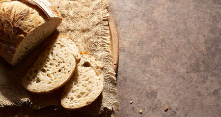 homemade sourdough bread on a painted background located on the left of the imageの写真素材