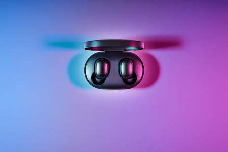 wireless headphones on two color background, top viewの写真素材