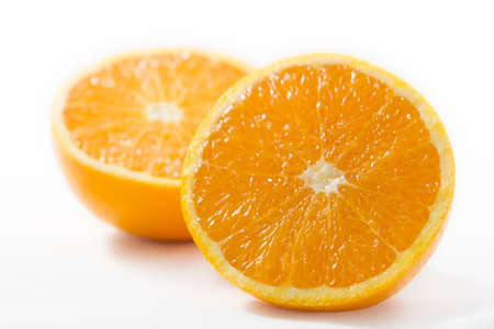 Two half orange on a white background.の写真素材