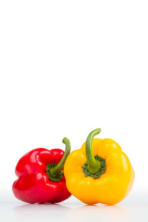 Colourful fresh isolated peppers on white background.の写真素材