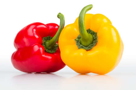 Colourful fresh isolated peppers on white background.の写真素材