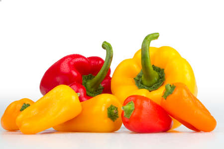 Colourful fresh isolated peppers on white background.の写真素材