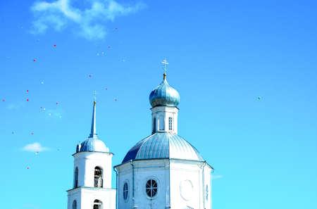 Round kupala church with crosses, blue skyの写真素材
