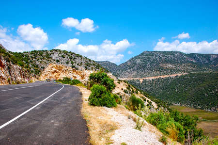 The road to the picturesque green mountainsの写真素材
