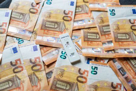 Corona virus SARS-Cov-2 antigen test on fifty euro banknotes
