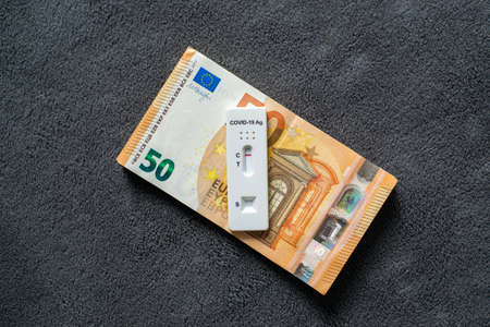 Corona virus SARS-Cov-2 antigen test on fifty euro banknotesの写真素材