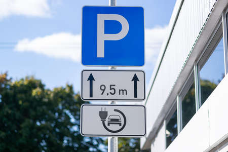 Electric car charging station at a parking lot in Europeの写真素材