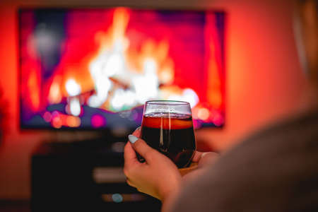 Girl holding glass of mulled wine