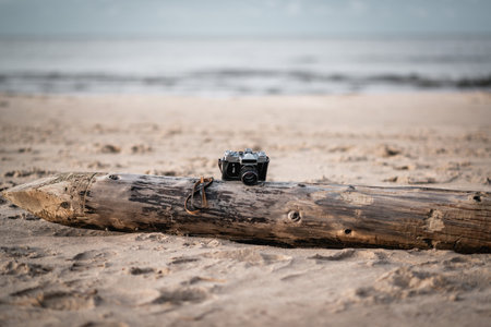 Stylish soviet vintage camera at the beachの写真素材