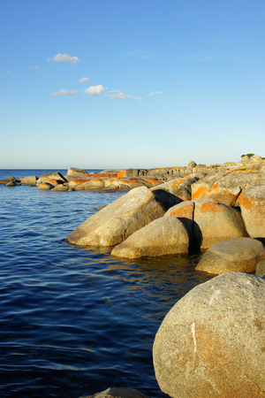 Sunset on Bay of Fires, Tasmania, Australiaの写真素材