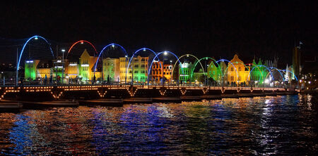 WILLEMSTAD, CURACAO - DECEMBER 10, 2013  Panorama of the Queen Emma Bridge in front of the Punda district at night on December 10, 2013 in Willemstad, Curacao, ABC Islands,のeditorial素材