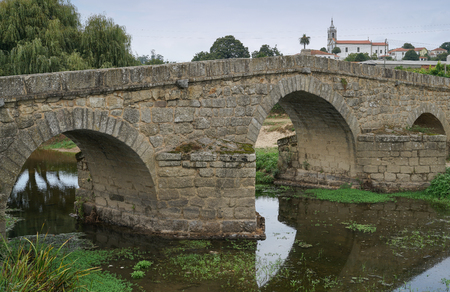 Roman bridge of Arcos, sights along the Camino de Santiago trail, Portugalの写真素材