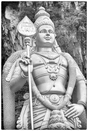 BATU CAVES, MALAYSIA - JANUARY 29, 2011: Statue of Goddess on the stairs to the holy caves of Batu on January 29, 2011 in Malaysiaのeditorial素材