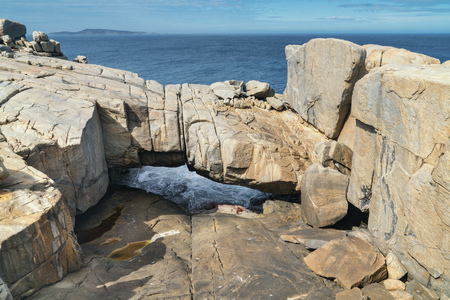 Natural bridge within the amazing Torndirrup National Park close to Albany, Western Australiaの写真素材