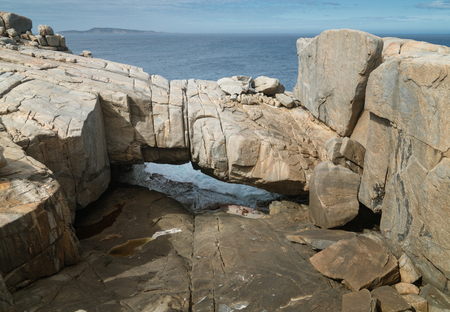 Natural bridge within the amazing Torndirrup National Park close to Albany, Western Australiaの写真素材