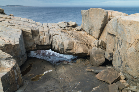 Natural bridge within the amazing Torndirrup National Park close to Albany, Western Australiaの写真素材