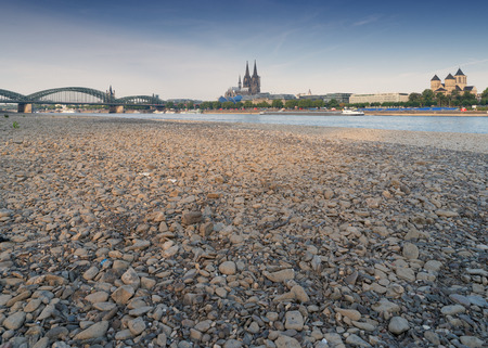 COLOGNE, GERMANY - JULY 20, 2018: Prolonged drought in Germany, low water of the Rhine river in Cologne at early morning time on July 20, 2018 in Germanyのeditorial素材
