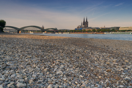 COLOGNE, GERMANY - JULY 20, 2018: Prolonged drought in Germany, low water of the Rhine river in Cologne at early morning time on July 20, 2018 in Germanyのeditorial素材