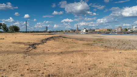 DUESSELDORF, GERMANY - AUGUST 10, 2018: Drought in Germany, low water of the Rhine river with the cityscape of Duesseldorf on August 10, 2018 in Germanyのeditorial素材