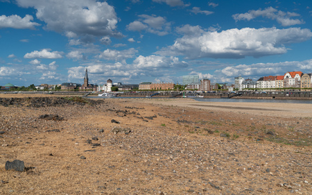 DUESSELDORF, GERMANY - AUGUST 10, 2018: Drought in Germany, low water of the Rhine river with the cityscape of Duesseldorf on August 10, 2018 in Germanyのeditorial素材