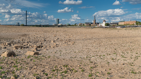 DUESSELDORF, GERMANY - AUGUST 11, 2018: Drought in Germany, low water of the Rhine river with the cityscape of Duesseldorf on August 11, 2018 in Germanyのeditorial素材