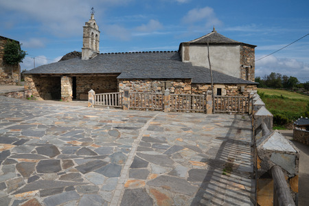 Old church Santa Maria Magdalena in sunlight with blue sky, Penafonte, Camino de Santiago close to Grandas de Salime, Asturias, Spainのeditorial素材
