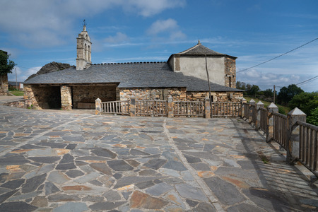 Old church Santa Maria Magdalena in sunlight with blue sky, Penafonte, Camino de Santiago close to Grandas de Salime, Asturias, Spainのeditorial素材