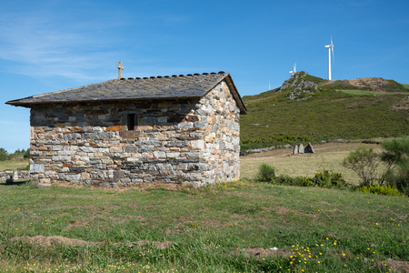 MOUNT MONTOUTO, SPAIN - AUGUST 26, 2018: Old chapel an pilgrim hospital on Mount Montouto, Camino de Santiago trail between Fonsagrada and O Cadavo on August 26, 2018 in Galicia, Spainのeditorial素材