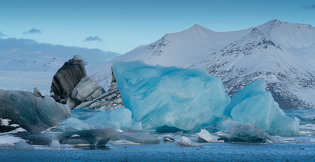 Panoramic view of the glacier lagoon Joekulsarlon with icebergs and in the background the glacier, winter in Iceland, Europeの写真素材