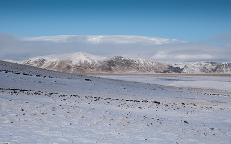 Panoramic image of the Myrdalsjo?kull glacier with low clouds, winter in Icelandの写真素材