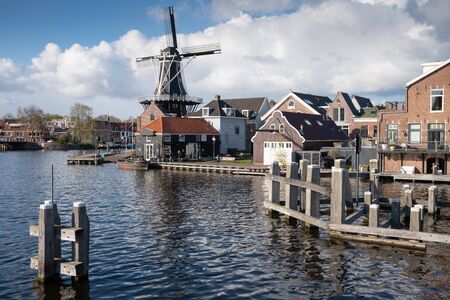 HAARLEM, NETHERLANDS - APRIL 13, 2019: Old windmill in the city center of Haarlem on April 13, 2019 in the Netherlandsのeditorial素材