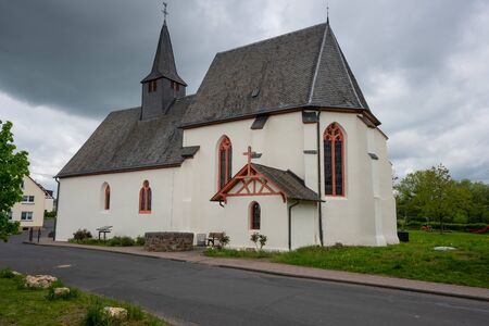 Panoramic image of the pilgrim church Maria and Maria Magdalena of Valwigerberg with cloudy sky, Cochem, Germanyの写真素材